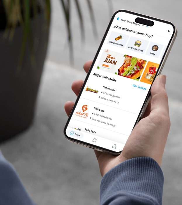 mockuuups-iphone-15-pro-mockup-in-male-hand-with-modern-decor